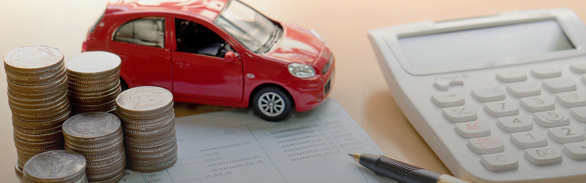 Toy car, change, and a calculator