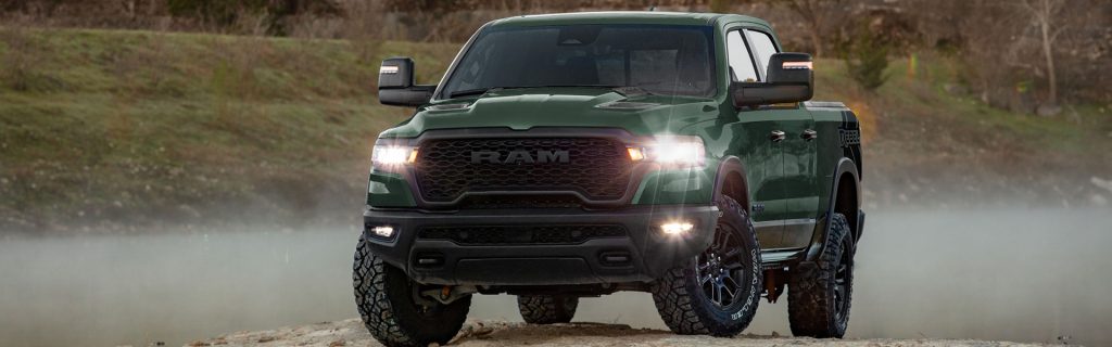 Ram 1500 standing in a mountain cliff showcasing its unique design and features.