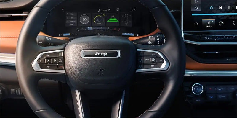 Jeep Compass steering wheel and dashboard view